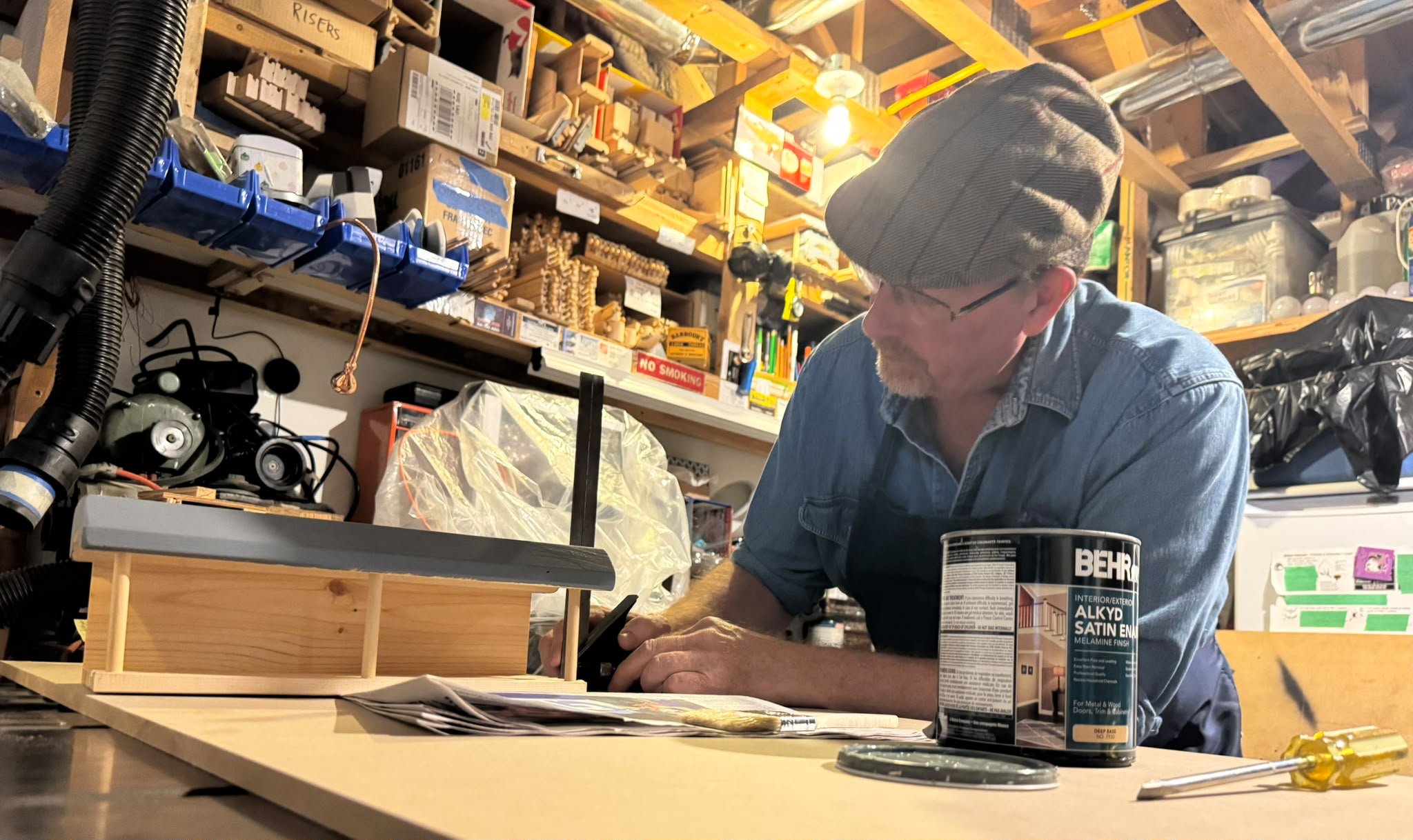 Mitch working on a handmade wooden railway product in his workshop